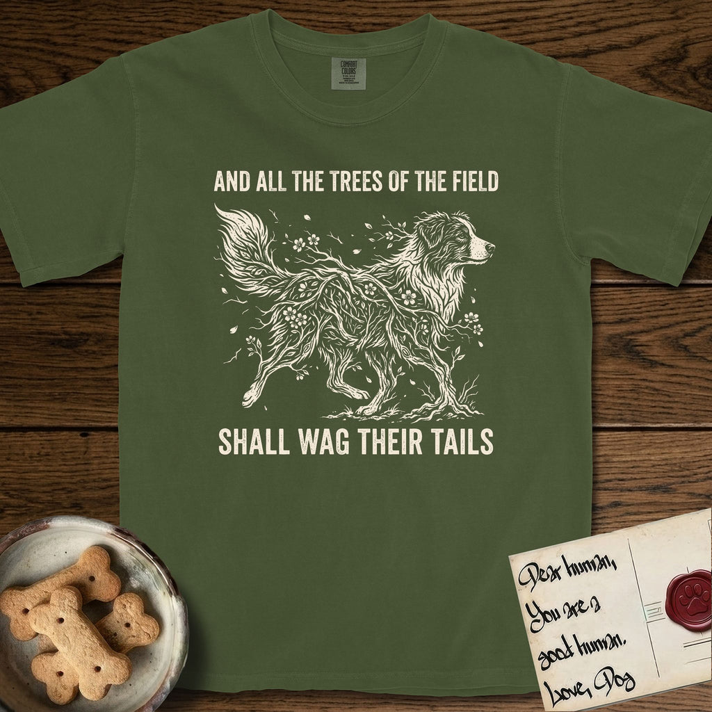 Trees of the Field Australian Shepherd T-Shirt flat lay in Hemp, featuring a vintage woodcut illustration of an Australian Shepherd formed of flowering cherry branches, mid-stride, with the words And All the Trees of the Field Shall Wag Their Tails.