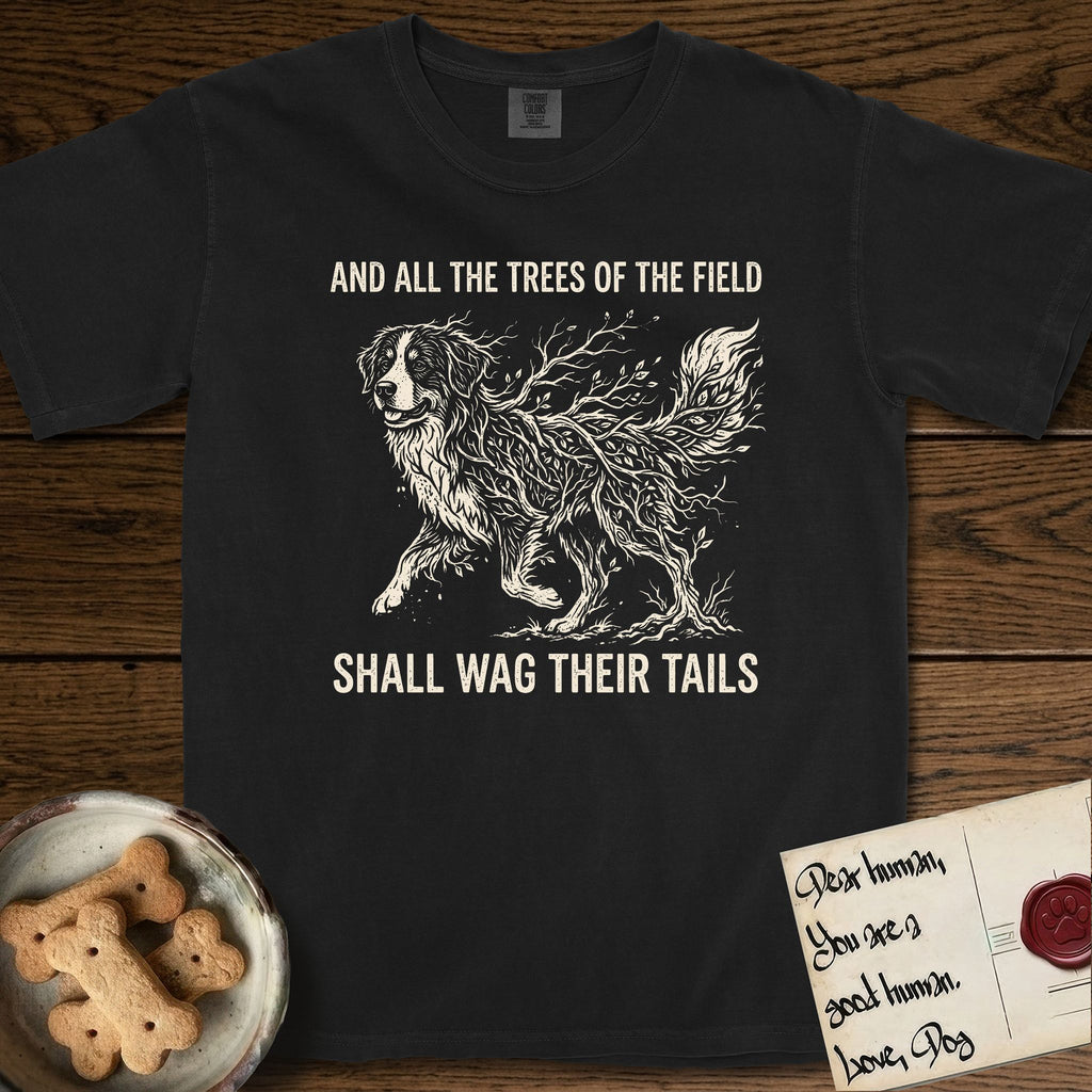 Trees of the Field Bernese Mountain Dog T-Shirt flat lay in Black, featuring a vintage woodcut illustration of a Bernese Mountain Dog formed of bare windswept winter branches, mid-stride, with the words And All the Trees of the Field Shall Wag Their Tails.