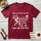 Trees of the Field Border Collie T-Shirt flat lay in Antique Cherry Red, featuring a vintage woodcut illustration of a Border Collie formed of quaking aspen branches, mid-stride, with the words And All the Trees of the Field Shall Wag Their Tails.