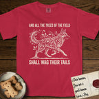 Trees of the Field German Shepherd T-Shirt flat lay in Red, featuring a vintage woodcut illustration of a German Shepherd formed of oak branches with acorns, mid-stride, with the words And All the Trees of the Field Shall Wag Their Tails.