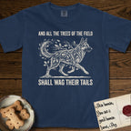 Trees of the Field German Shepherd T-Shirt flat lay in True Navy, featuring a vintage woodcut illustration of a German Shepherd formed of oak branches with acorns, mid-stride, with the words And All the Trees of the Field Shall Wag Their Tails.