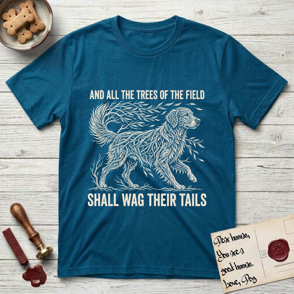 Trees of the Field Golden Retriever T-Shirt flat lay in Antique Sapphire, featuring a vintage woodcut illustration of a Golden Retriever formed of flowing willow branches, mid-stride, with the words And All the Trees of the Field Shall Wag Their Tails.
