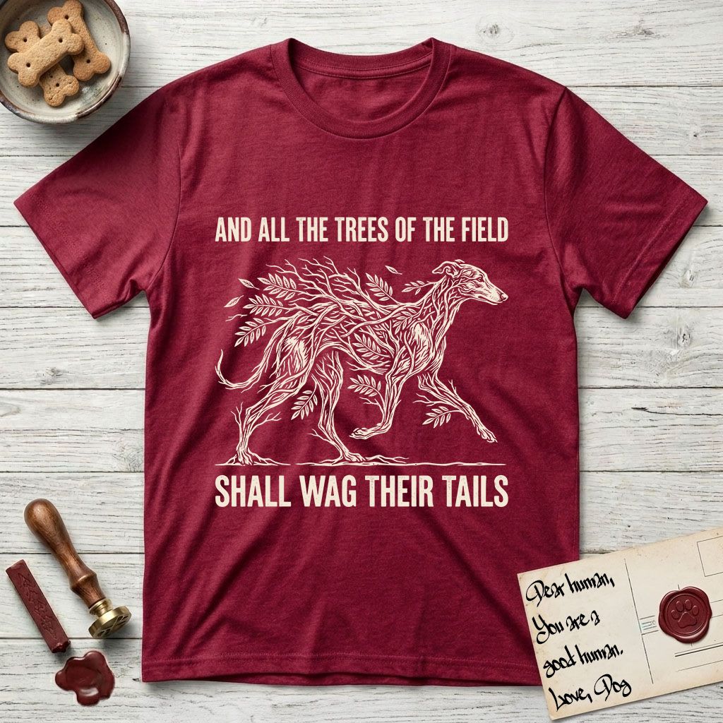 Trees of the Field Greyhound T-Shirt flat lay in Antique Cherry Red, featuring a vintage woodcut illustration of a Greyhound formed of ash branches with streaming leaves, mid-stride, with the words And All the Trees of the Field Shall Wag Their Tails.