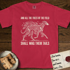 Trees of the Field Greyhound T-Shirt flat lay in Red, featuring a vintage woodcut illustration of a Greyhound formed of ash branches with streaming leaves, mid-stride, with the words And All the Trees of the Field Shall Wag Their Tails.