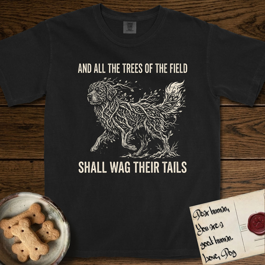 Trees of the Field Newfoundland T-Shirt flat lay in Black, featuring a vintage woodcut illustration of a Newfoundland formed of linden branches in full leaf, mid-stride, with the words And All the Trees of the Field Shall Wag Their Tails.