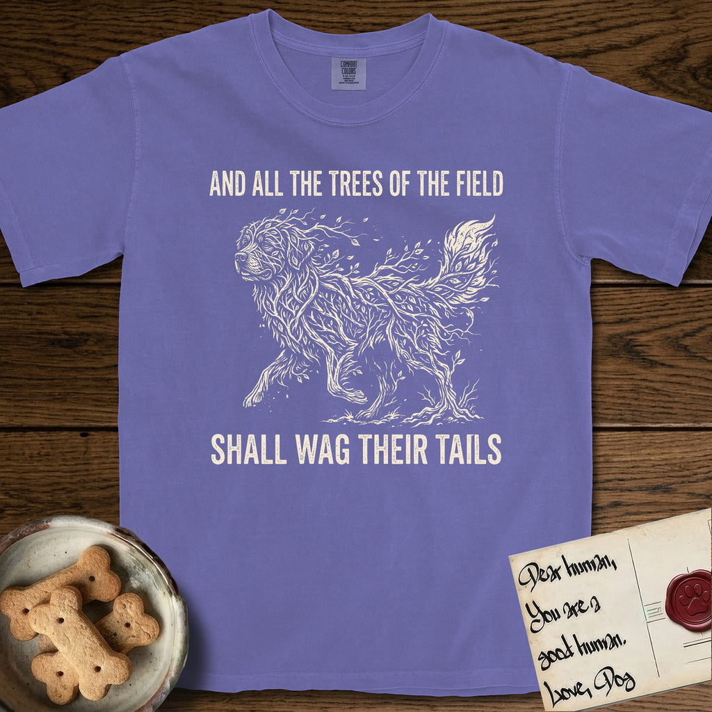 Trees of the Field Newfoundland T-Shirt flat lay in Violet, featuring a vintage woodcut illustration of a Newfoundland formed of linden branches in full leaf, mid-stride, with the words And All the Trees of the Field Shall Wag Their Tails.