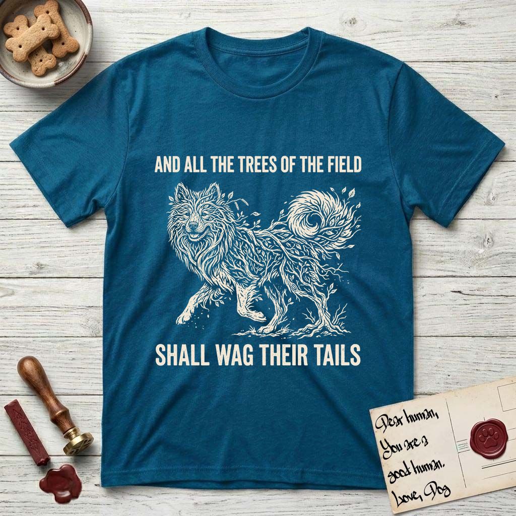 Trees of the Field Samoyed T-Shirt flat lay in Antique Sapphire, featuring a vintage woodcut illustration of a Samoyed formed of white birch branches with catkins, mid-stride, with the words And All the Trees of the Field Shall Wag Their Tails.