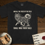 Trees of the Field Samoyed T-Shirt flat lay in Black, featuring a vintage woodcut illustration of a Samoyed formed of white birch branches with catkins, mid-stride, with the words And All the Trees of the Field Shall Wag Their Tails.
