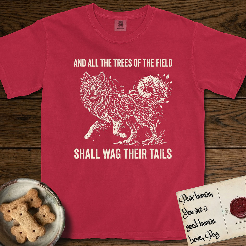 Trees of the Field Samoyed T-Shirt flat lay in Red, featuring a vintage woodcut illustration of a Samoyed formed of white birch branches with catkins, mid-stride, with the words And All the Trees of the Field Shall Wag Their Tails.