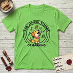 The Joyful Sound of Barking T-Shirt flat lay in Lime, featuring a flat vector cartoon emblem of a happy puppy with lifted ears surrounded by musical notes, ringed by the words The Joyful Sound of Barking.