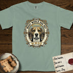 What Would Dog Do Beagle T-Shirt flat lay in Bay, featuring a baroque scrollwork gold portrait medallion of a haloed Beagle with the question What Would Dog Do.