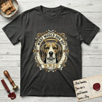 What Would Dog Do Beagle T-Shirt flat lay in Charcoal, featuring a baroque scrollwork gold portrait medallion of a haloed Beagle with the question What Would Dog Do.