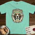 What Would Dog Do Beagle T-Shirt flat lay in Island Reef, featuring a baroque scrollwork gold portrait medallion of a haloed Beagle with the question What Would Dog Do.