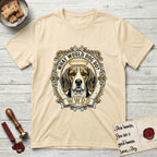 What Would Dog Do Beagle T-Shirt flat lay in Natural, featuring a baroque scrollwork gold portrait medallion of a haloed Beagle with the question What Would Dog Do.