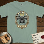 What Would Dog Do Boxer T-Shirt flat lay in Bay, featuring a Greek-key bordered gold portrait medallion of a haloed Boxer with natural uncropped ears and the question What Would Dog Do.