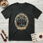 What Would Dog Do Boxer T-Shirt flat lay in Black, featuring a Greek-key bordered gold portrait medallion of a haloed Boxer with natural uncropped ears and the question What Would Dog Do.