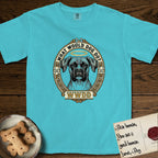 What Would Dog Do Boxer T-Shirt flat lay in Lagoon Blue, featuring a Greek-key bordered gold portrait medallion of a haloed Boxer with natural uncropped ears and the question What Would Dog Do.