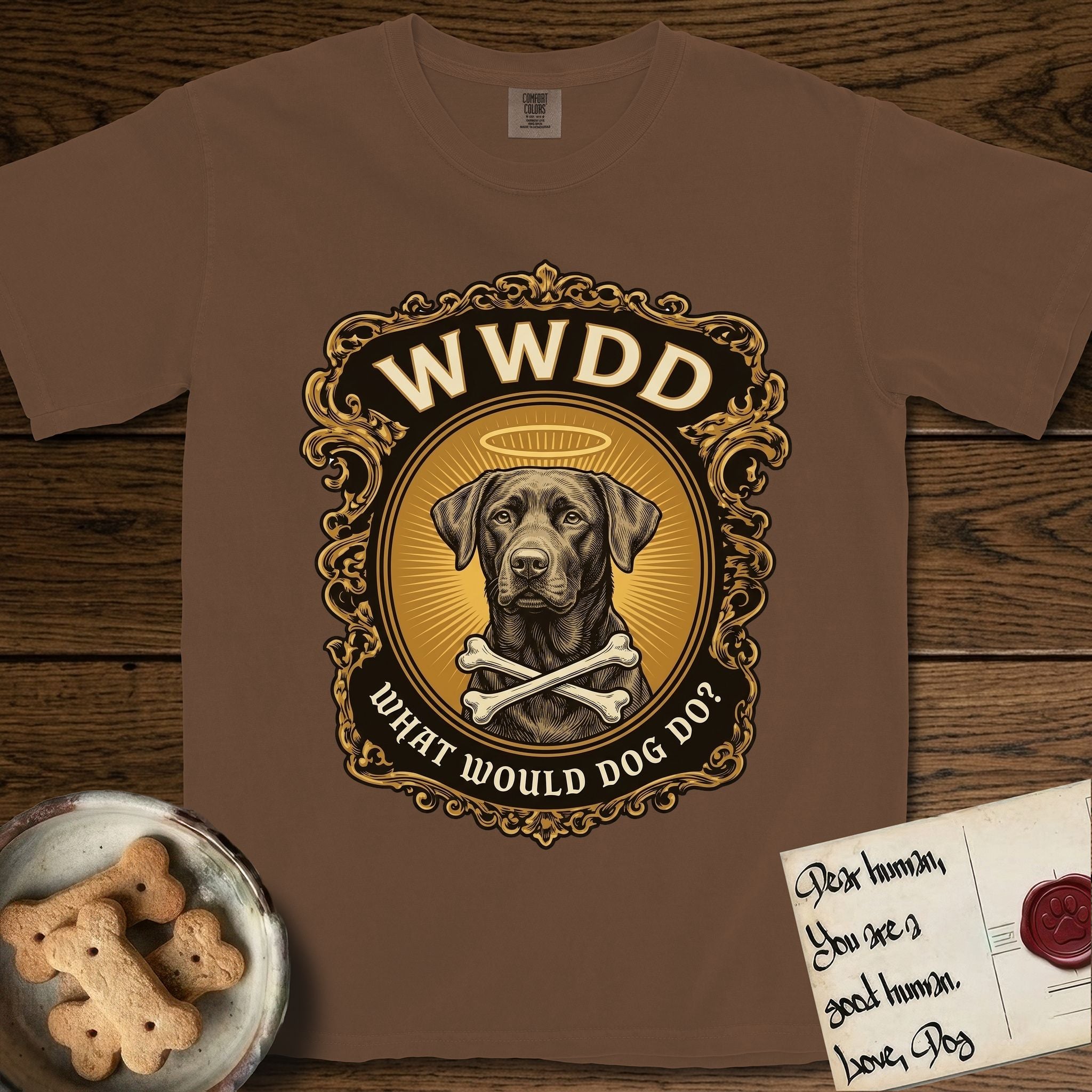 What Would Dog Do Chocolate Lab T-Shirt flat lay in Espresso, featuring a baroque gold ornate portrait medallion of a haloed Chocolate Lab with the question What Would Dog Do.