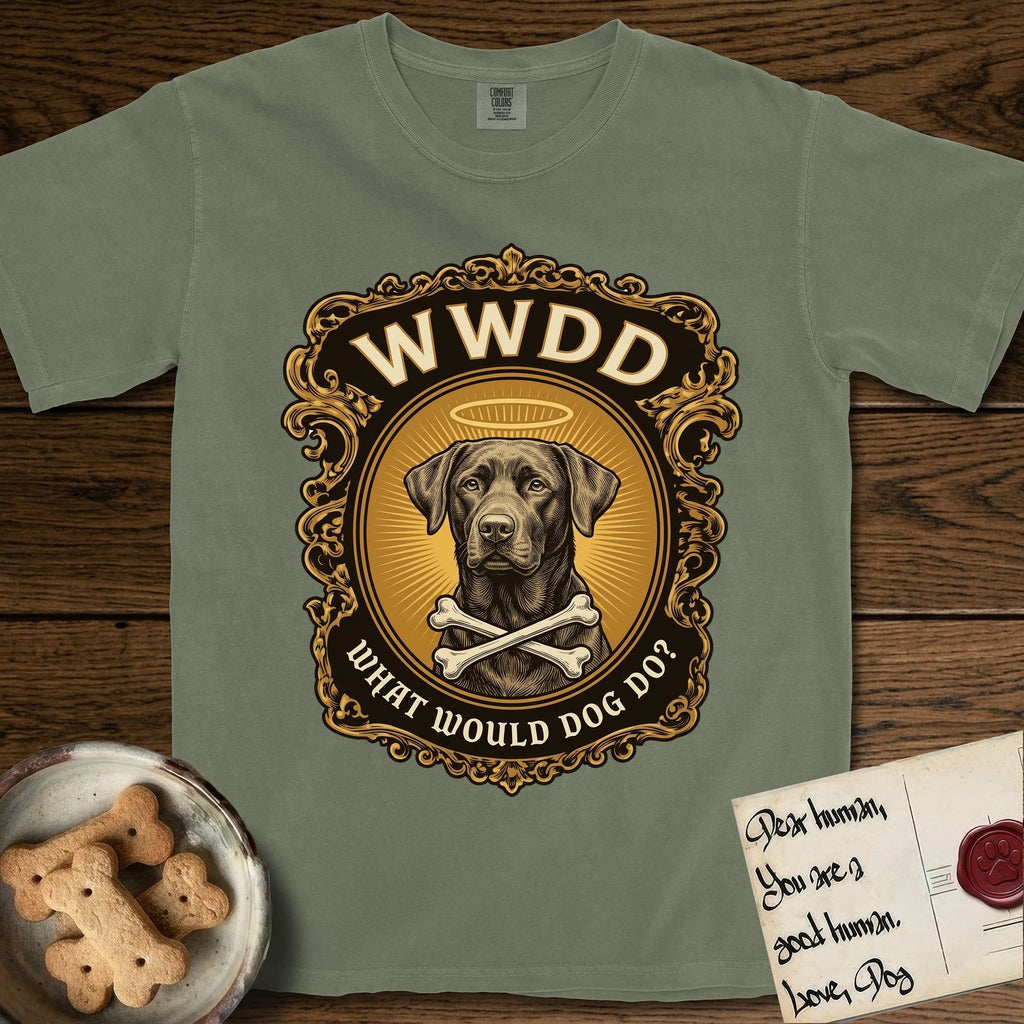 What Would Dog Do Chocolate Lab T-Shirt flat lay in Sage, featuring a baroque gold ornate portrait medallion of a haloed Chocolate Lab with the question What Would Dog Do.