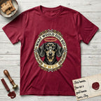 What Would Dog Do Dachshund T-Shirt flat lay in Antique Cherry Red, featuring an oak-leaf and acorn framed gold portrait medallion of a haloed Dachshund with the question What Would Dog Do.