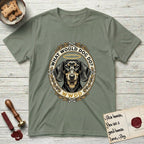 What Would Dog Do Dachshund T-Shirt flat lay in Sage, featuring an oak-leaf and acorn framed gold portrait medallion of a haloed Dachshund with the question What Would Dog Do.
