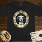 What Would Dog Do Dalmatian T-Shirt flat lay in Black, featuring a vintage gold portrait medallion of a haloed Dalmatian in an engraved coin-style dotted border with the question What Would Dog Do.