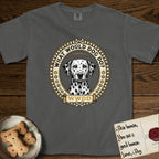 What Would Dog Do Dalmatian T-Shirt flat lay in Pepper, featuring a vintage gold portrait medallion of a haloed Dalmatian in an engraved coin-style dotted border with the question What Would Dog Do.