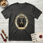 What Would Dog Do Doberman T-Shirt flat lay in Charcoal, featuring a fleur-de-lis framed gold portrait medallion of a haloed Doberman with natural uncropped ears and the question What Would Dog Do.