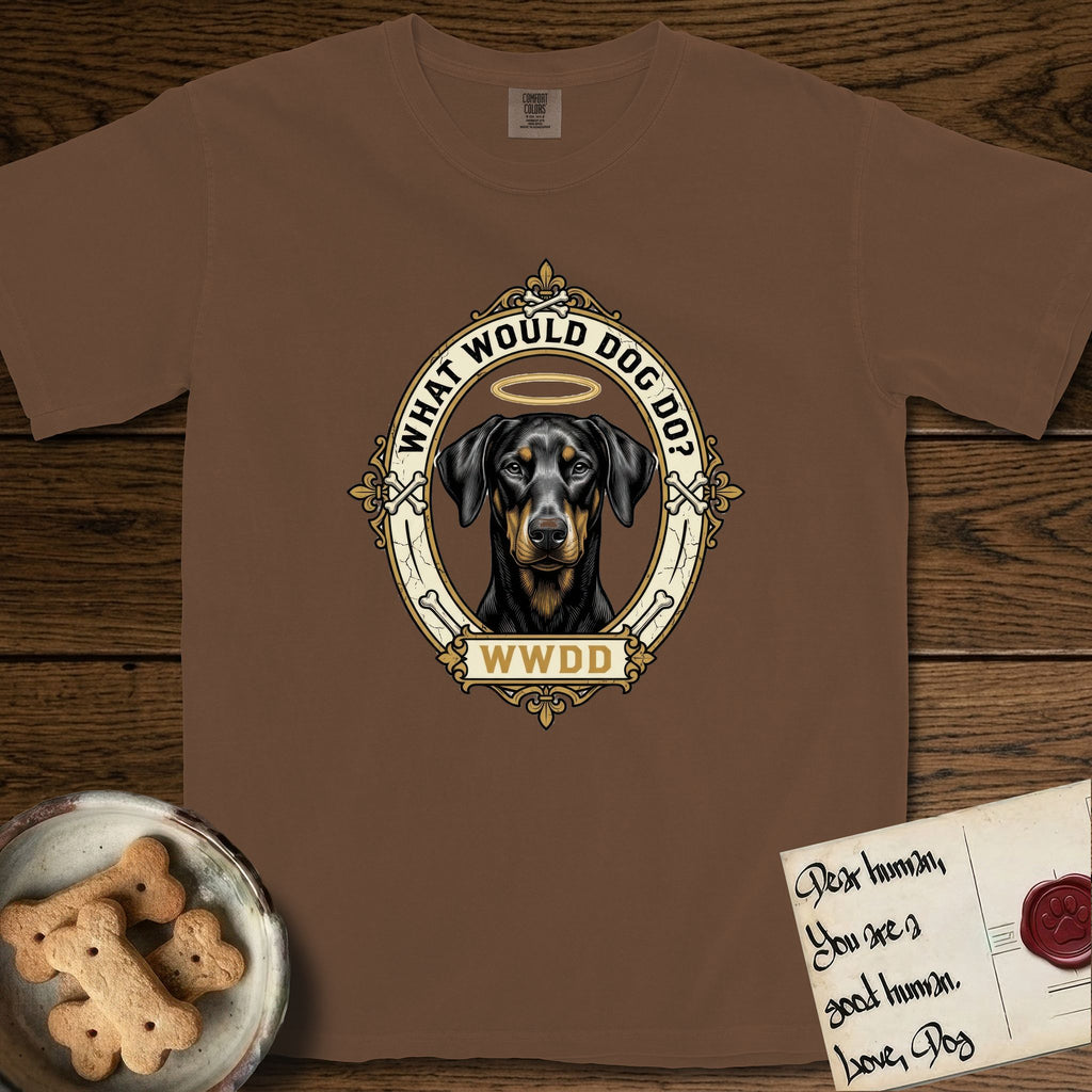 What Would Dog Do Doberman T-Shirt flat lay in Espresso, featuring a fleur-de-lis framed gold portrait medallion of a haloed Doberman with natural uncropped ears and the question What Would Dog Do.