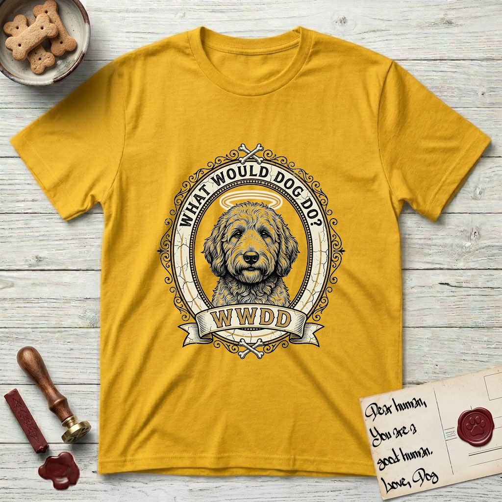 What Would Dog Do Goldendoodle T-Shirt flat lay in Daisy, featuring an ornate scrollwork gold portrait medallion of a haloed Goldendoodle with the question What Would Dog Do.
