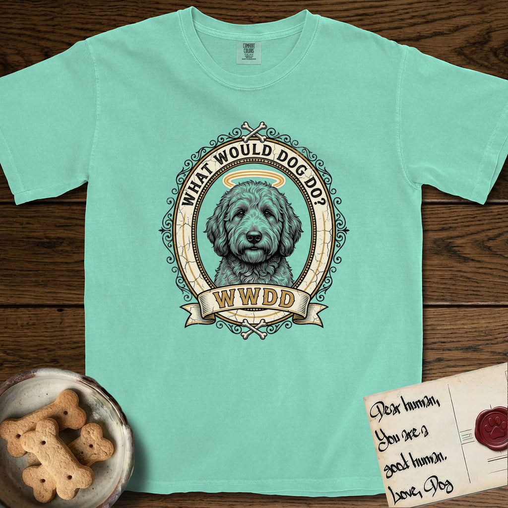 What Would Dog Do Goldendoodle T-Shirt flat lay in Island Reef, featuring an ornate scrollwork gold portrait medallion of a haloed Goldendoodle with the question What Would Dog Do.