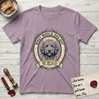 What Would Dog Do Goldendoodle T-Shirt flat lay in Paragon, featuring an ornate scrollwork gold portrait medallion of a haloed Goldendoodle with the question What Would Dog Do.