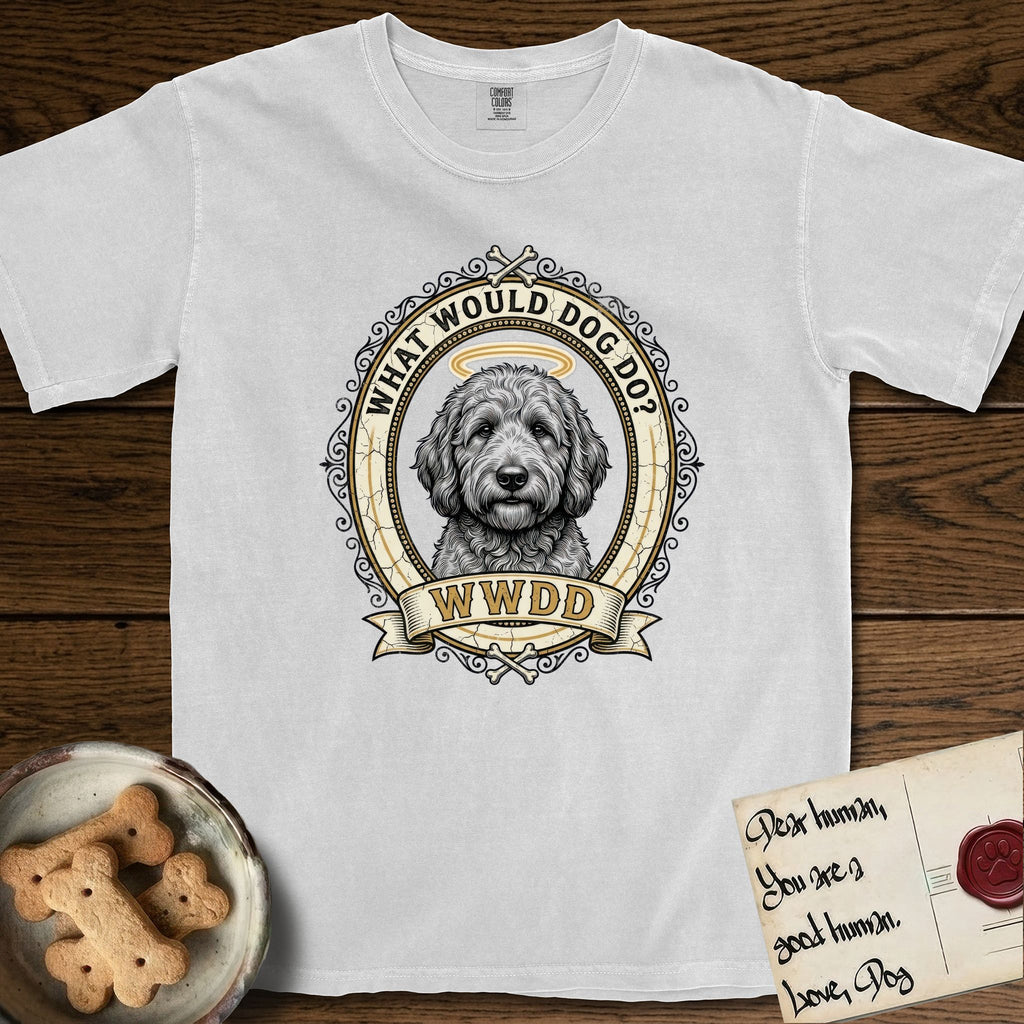 What Would Dog Do Goldendoodle T-Shirt flat lay in White, featuring an ornate scrollwork gold portrait medallion of a haloed Goldendoodle with the question What Would Dog Do.