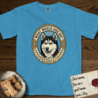 What Would Dog Do Husky T-Shirt flat lay in Royal Caribe, featuring a vintage gold portrait medallion of a haloed blue-eyed Husky in a Nordic snowflake border with the question What Would Dog Do.
