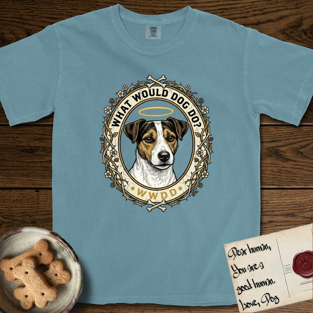 What Would Dog Do Jack Russell T-Shirt flat lay in Ice Blue, featuring a vintage gold portrait medallion of a haloed Jack Russell in a wreath of thorned branches and wildflowers with the question What Would Dog Do.