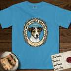 What Would Dog Do Jack Russell T-Shirt flat lay in Royal Caribe, featuring a vintage gold portrait medallion of a haloed Jack Russell in a wreath of thorned branches and wildflowers with the question What Would Dog Do.