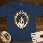What Would Dog Do Jack Russell T-Shirt flat lay in True Navy, featuring a vintage gold portrait medallion of a haloed Jack Russell in a wreath of thorned branches and wildflowers with the question What Would Dog Do.