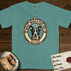 What Would Dog Do Lobo T-Shirt flat lay in Blue Spruce, featuring a baroque gold ornate portrait medallion of haloed Lobo with the question What Would Dog Do and a small PDX inscription.