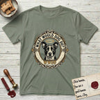 What Would Dog Do Lobo T-Shirt flat lay in Sage, featuring a baroque gold ornate portrait medallion of haloed Lobo with the question What Would Dog Do and a small PDX inscription.