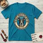 What Would Dog Do Lobo T-Shirt flat lay in Tropical Blue, featuring a baroque gold ornate portrait medallion of haloed Lobo with the question What Would Dog Do and a small PDX inscription.