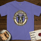 What Would Dog Do Lobo T-Shirt flat lay in Violet, featuring a baroque gold ornate portrait medallion of haloed Lobo with the question What Would Dog Do and a small PDX inscription.