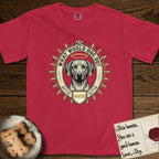 What Would Dog Do Rhodesian Ridgeback T-Shirt flat lay in Red, featuring a vintage gold portrait medallion of a haloed Rhodesian Ridgeback ringed by radiating sunburst spikes with the question What Would Dog Do.