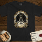 What Would Dog Do Saint Bernard T-Shirt flat lay in Black, featuring a vintage gold portrait medallion of a haloed Saint Bernard in an alpine laurel wreath with edelweiss blossoms and the question What Would Dog Do.