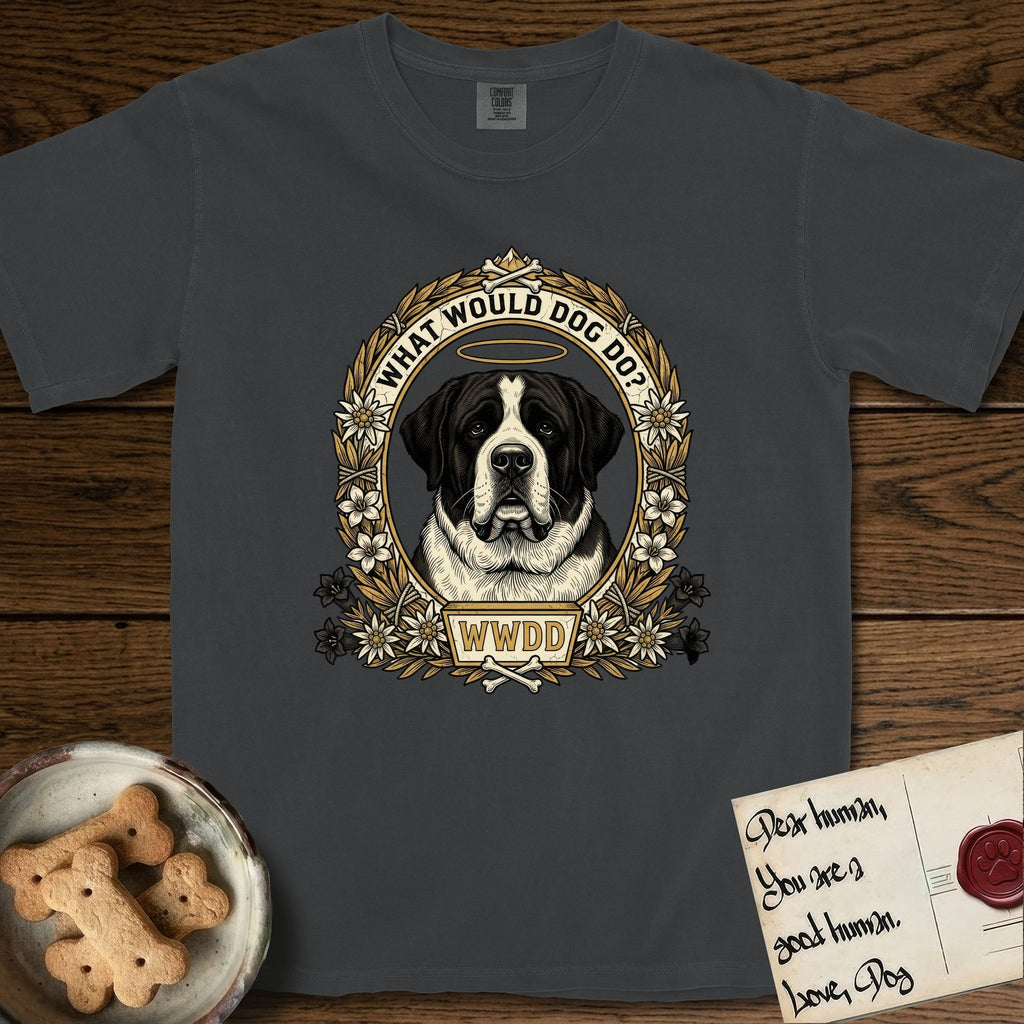 What Would Dog Do Saint Bernard T-Shirt flat lay in Graphite, featuring a vintage gold portrait medallion of a haloed Saint Bernard in an alpine laurel wreath with edelweiss blossoms and the question What Would Dog Do.