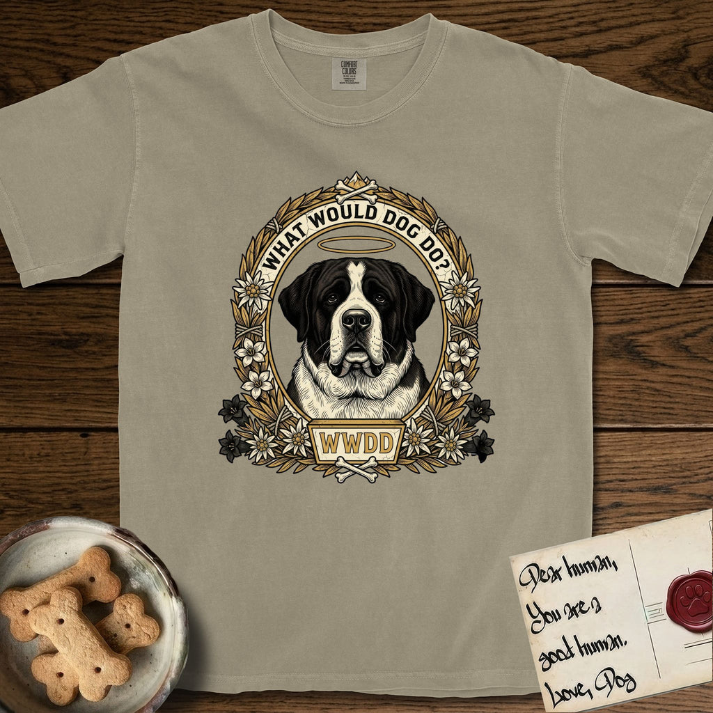 What Would Dog Do Saint Bernard T-Shirt flat lay in Khaki, featuring a vintage gold portrait medallion of a haloed Saint Bernard in an alpine laurel wreath with edelweiss blossoms and the question What Would Dog Do.