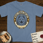 What Would Dog Do Samoyed T-Shirt flat lay in Blue Jean, featuring a rope-twist framed gold portrait medallion of a haloed Samoyed with the question What Would Dog Do.