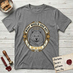 What Would Dog Do Samoyed T-Shirt flat lay in Graphite Heather, featuring a rope-twist framed gold portrait medallion of a haloed Samoyed with the question What Would Dog Do.
