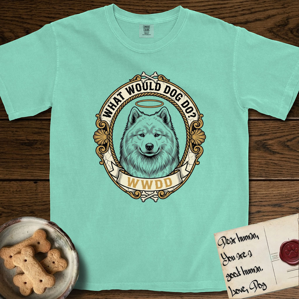 What Would Dog Do Samoyed T-Shirt flat lay in Island Reef, featuring a rope-twist framed gold portrait medallion of a haloed Samoyed with the question What Would Dog Do.