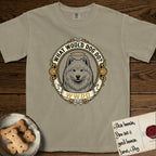 What Would Dog Do Samoyed T-Shirt flat lay in Khaki, featuring a rope-twist framed gold portrait medallion of a haloed Samoyed with the question What Would Dog Do.