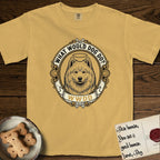 What Would Dog Do Samoyed T-Shirt flat lay in Mustard, featuring a rope-twist framed gold portrait medallion of a haloed Samoyed with the question What Would Dog Do.